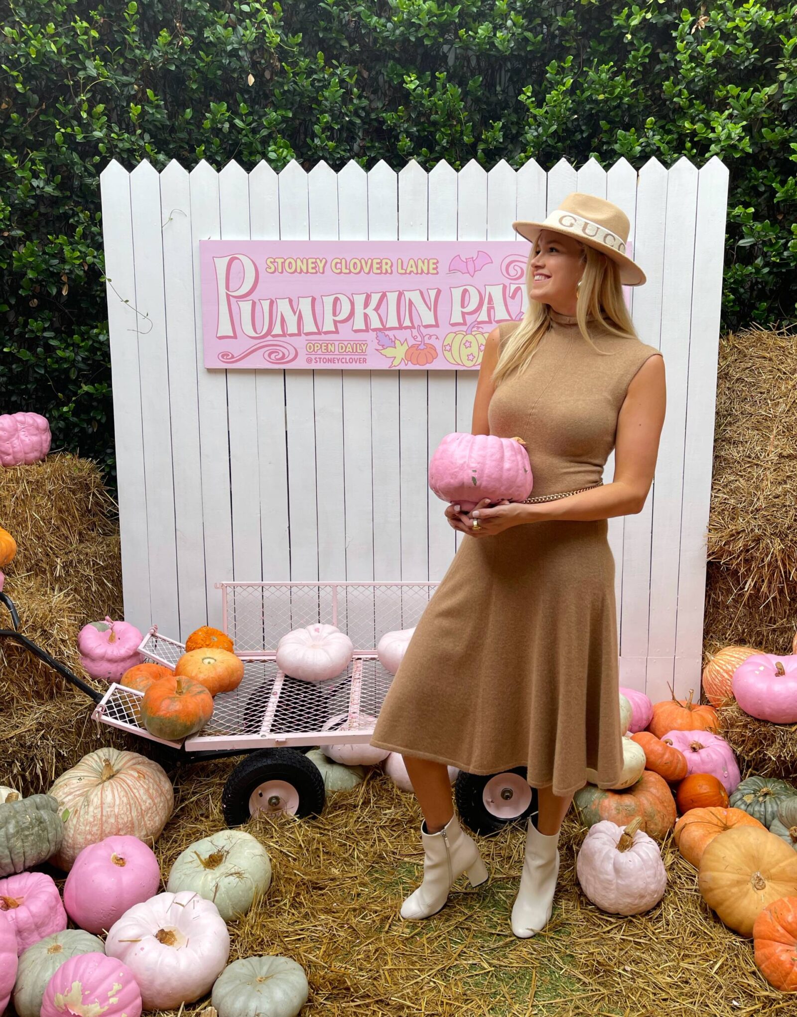 blonde girl wearing ralph lauren and gucci in stoney clover pumpkin patch in palm beach